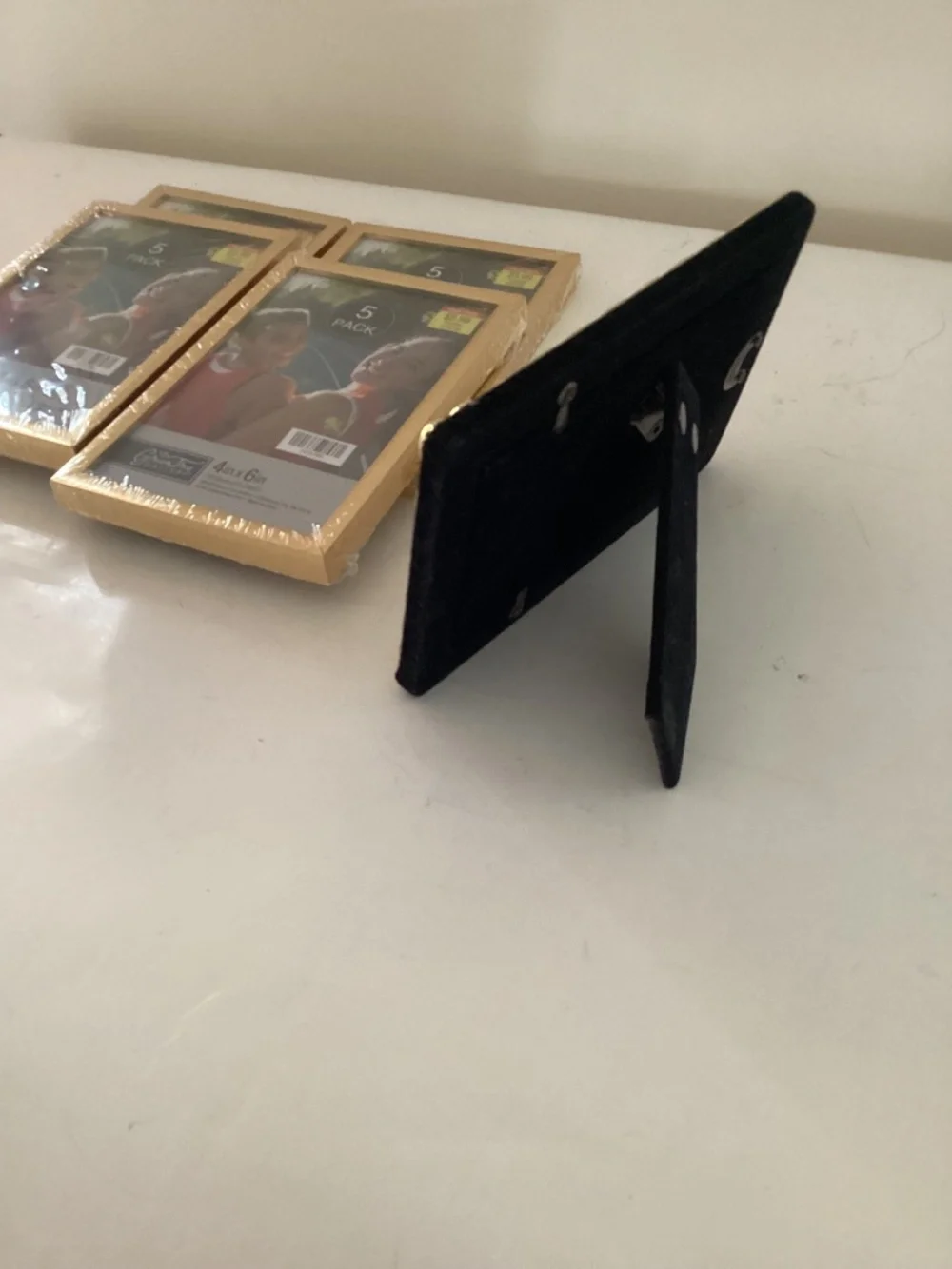 5 4x6 inch brass photo frames, 4 new/old stock in pkg. one pre owned